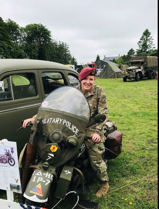 Capt. Jordan Browder sits atop a Military Police motorcycle at Sainte-Mere-Eglise in Normandy, France, Jun. 3, 2018 during the 74th D-Day Commemoration Ceremony after receiving her Dutch Jump Wings following a jump. Browder is currently building relationships with the Royal Thai Army as the Team Leader for Maneuver Advisor Team 5323.