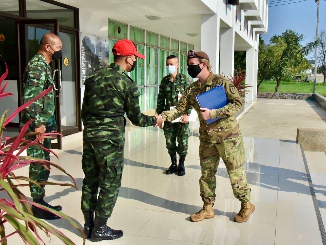 Capt. Jordan Browder, Team Leader, Maneuver Advisor Team 5323 meets with the Commander of 1st Battalion, NCO School Regiment, Royal Thai Army, Lt. Col. Adirek Wasansakul at Camp Hua Hin, Thailand, Mar. 3, 2022 to discuss combatives training at the RTA NCO Academy.  MAT 5323 is part of the 5th SFAB’s Force Package 22-1-I which places Advisor teams in locations across the Indo-Pacific to take part in combined interoperability training and strengthen longstanding partnerships in the region.