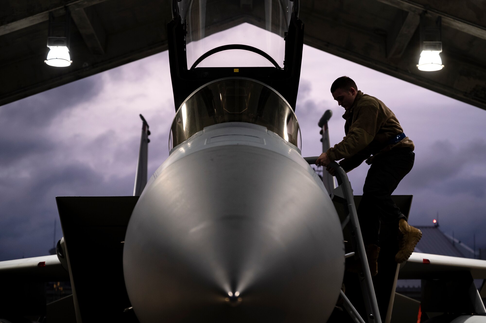 Airman 1st Class Zachary Warren, 44th Aircraft Maintenance Unit crew chief, prepares an F-15C Eagle for departure at Kadena Air Base, Japan, Dec. 1, 2022. The 18th Wing bid farewell to several aircraft during the first part of the Eagles' phased withdrawal. (U.S. Air Force photo by Senior Airman Jessi Roth)