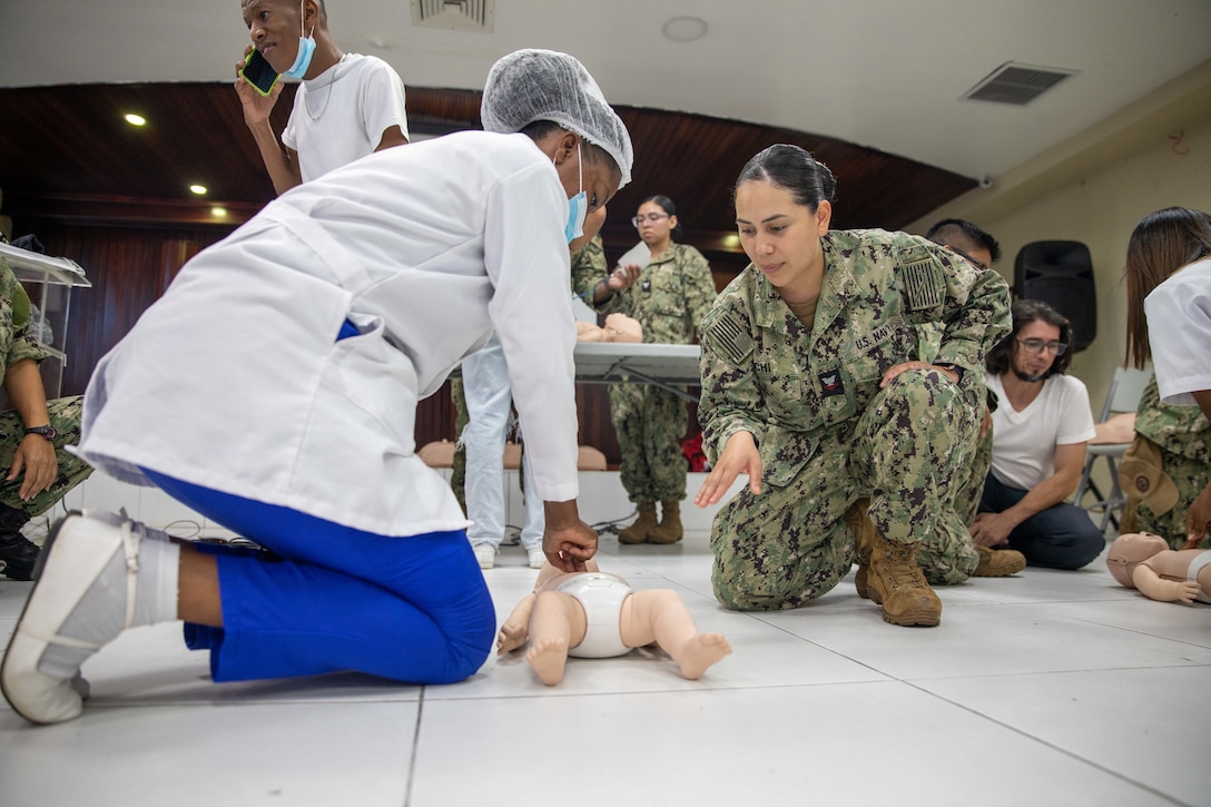 Hospital Corpsman 2nd Class Joahana Chi provides infant CPR training during a Continuing Promise visit to Hospital Dr. Francisco E. Moscoso Puello in Santo Domingo, Dominican Republic.