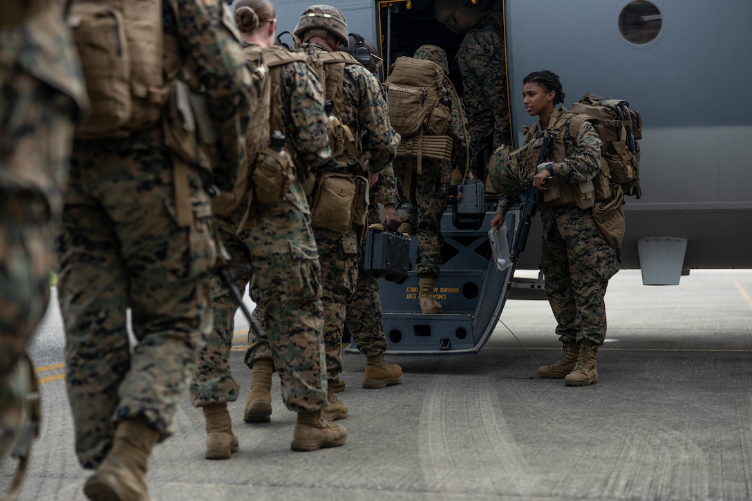 U.S. Marines with 3d Marine Division board a KC-130J Super Hercules during an Alert Contingency Marine Air-Ground Task Force drill on Okinawa, Japan, initiating the deployment of the division’s Forward Command Element participating in KAMANDAG 6 in the Philippines, Sept. 27, 2022. KAMANDAG is an annual bilateral exercise between the Armed Forces of the Philippines and U.S. military designed to strengthen interoperability, capabilities, trust, and cooperation built over decades of shared experiences. (U.S. Marine Corps photo by Sgt. Levi J. Guerra)