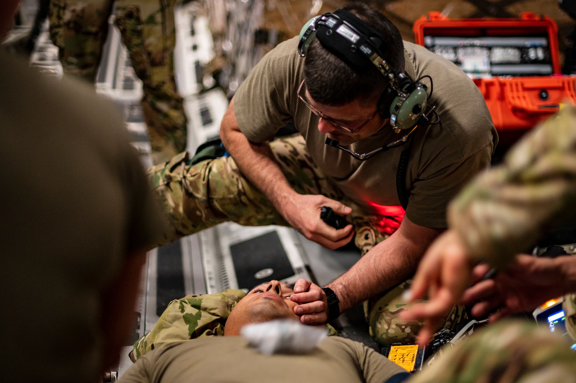 A man performs medical procedure on another