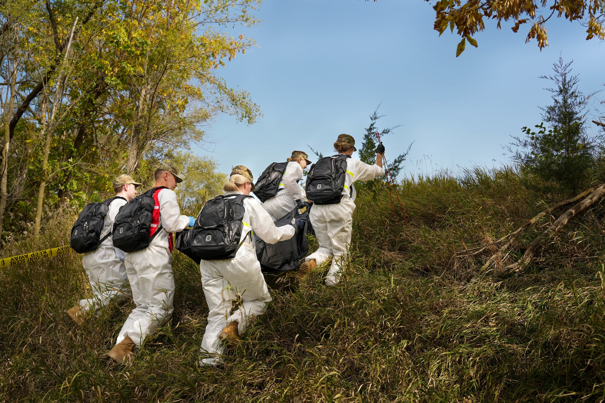 Airmen with the 114th Fighter Wing Force Support Squadron practice search and recovery procedures in various terrain during a field exercise during October’s Unit Training Assembly at Great Bear Recreation Park, Sioux Falls, South Dakota, Oct. 1, 2022. During the training, individuals used meticulous search methods to locate items that may be found in a real-world situation like personal effects and human remains. (U.S. Air National Guard photo by Staff Sgt. Jorrie Hart)