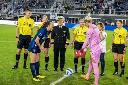 WASHINGTON (Oct. 01, 2022) - Chief of Naval Operations Adm. Mike Gilday participates in the coin toss at a National Women's Soccer League game at Audi Field where the Washington Spirit highlighted Women in the Navy (WIN), Oct. 1. During the game, between the Washington Spirit and the Houston Dash, Navy women, which included Sailors and civilians, were recognized on the field for their service. (U.S. Navy photo by Mass Communication Specialist 1st Class Michael B. Zingaro/released)