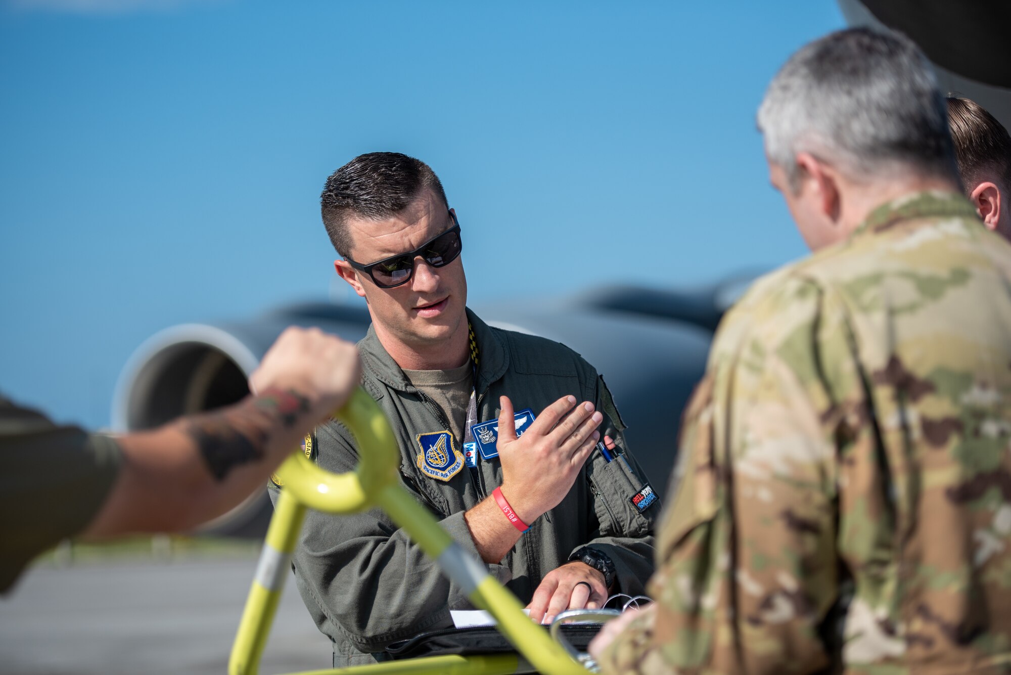 Pilot conducts preflight briefing to crew