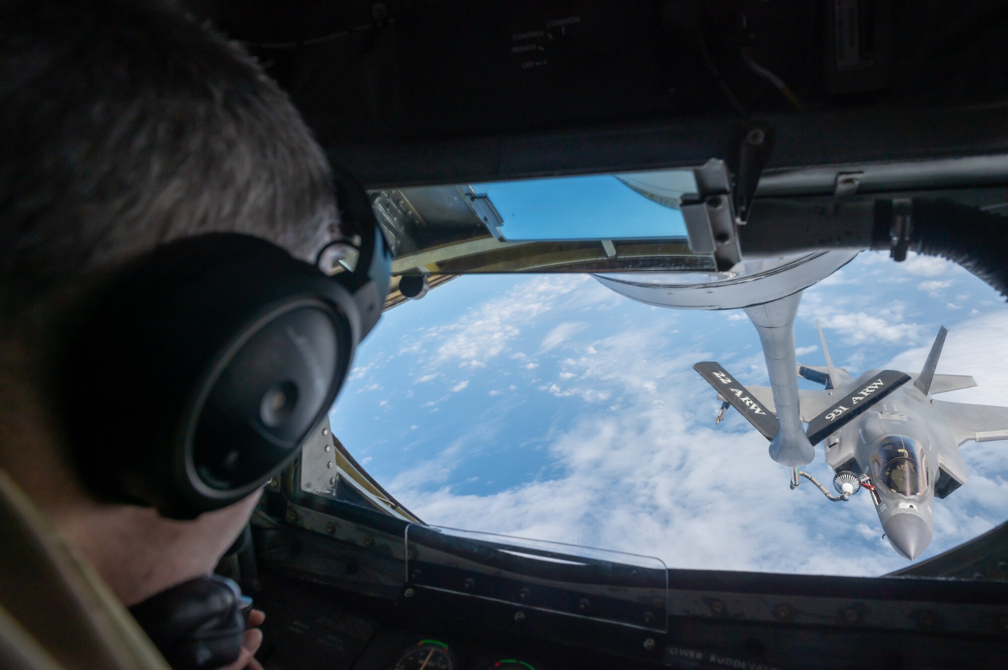 boom operator refuels a jet