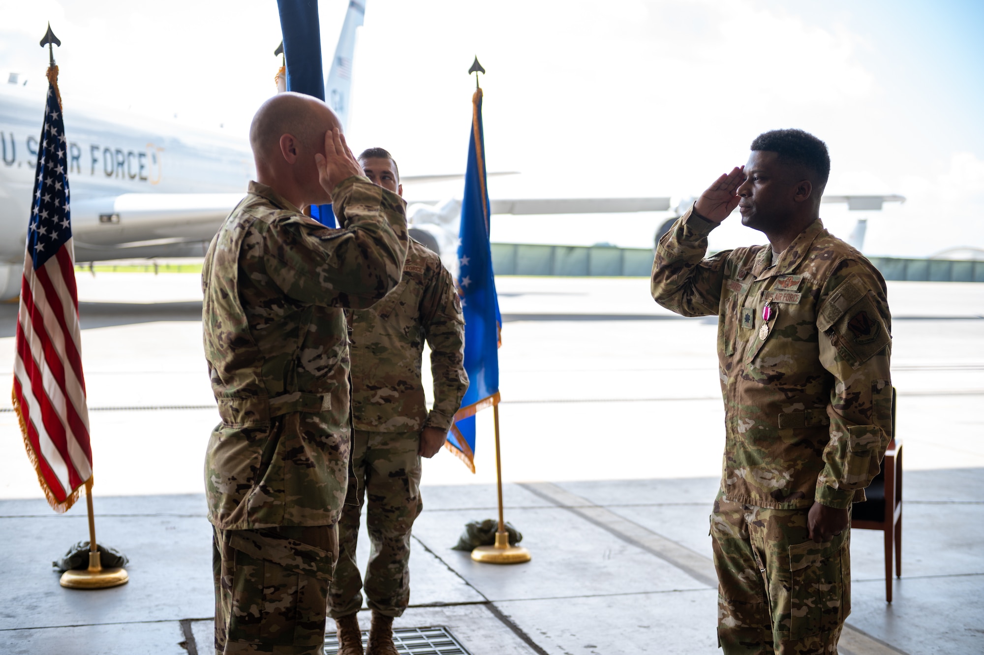U.S. Air Force Lt. Col. Joseph Hayes Jr. (right), renders his final salute as the 5th Expeditionary Airborne Command and Control Squadron commander to U.S. Air Force Col. Henry Schantz, 18th Operations Group commander, during the 5th EACCS deactivation ceremony