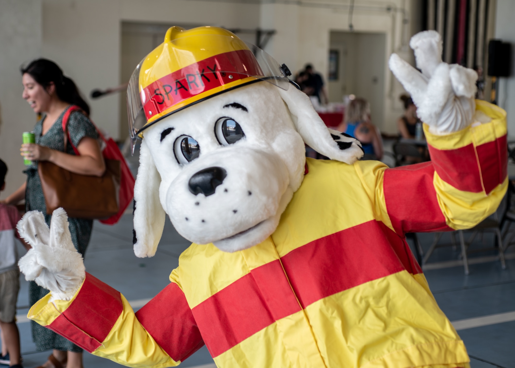 Sparky the dog, a fire station mascot, greets guests at an open house