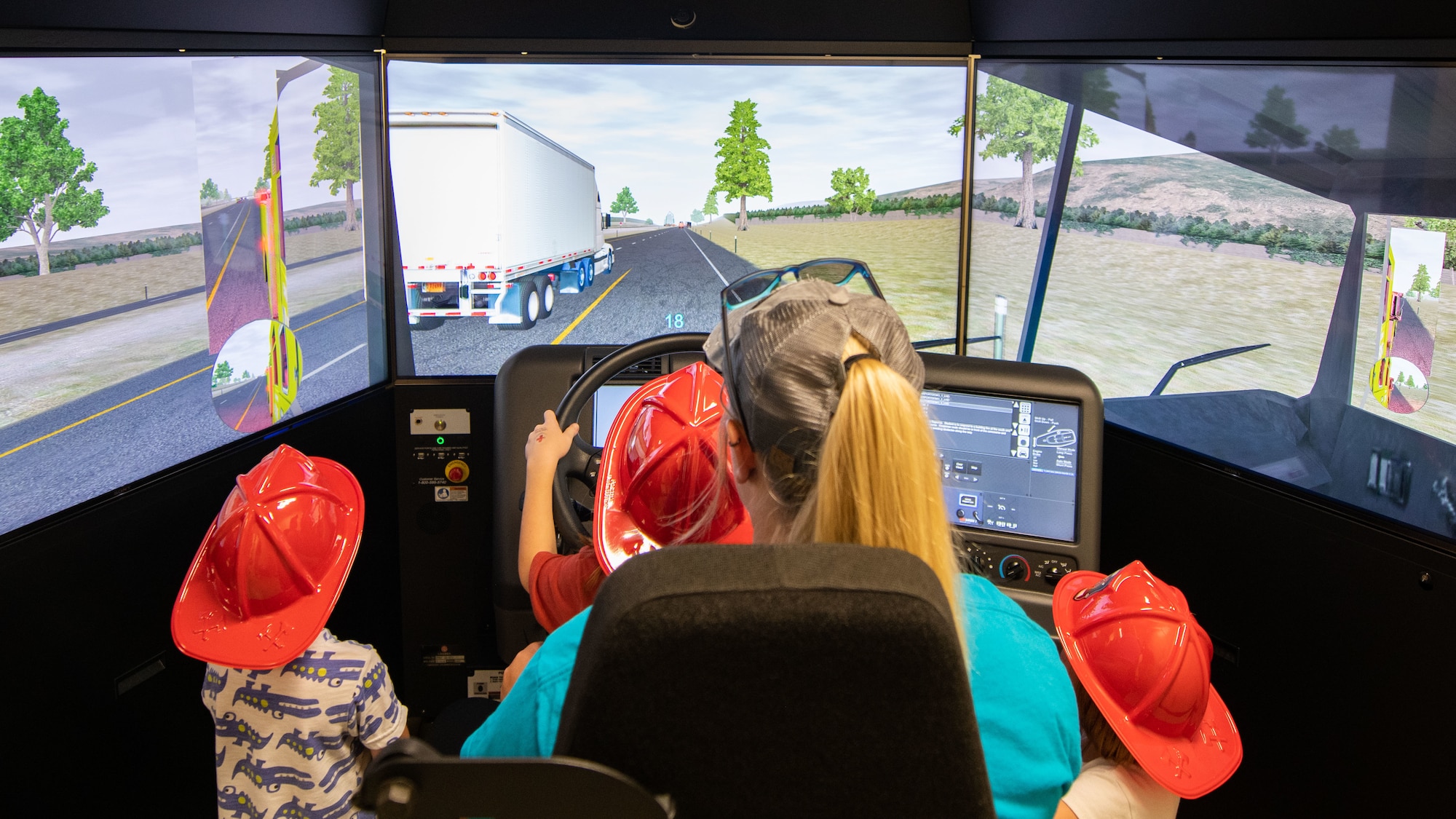 people drive a virtual reality firetruck