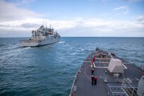 The Arleigh Burke-class guided-missile destroyer USS Roosevelt (DDG 80) conducts a replenishment-at-sea with dry cargo ship USNS William McLean (T-AKE 12), Oct. 1, 2022.
