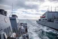 The Arleigh Burke-class guided-missile destroyer USS Roosevelt (DDG 80) conducts a replenishment-at-sea with dry cargo ship USNS William McLean (T-AKE 12), Oct. 1, 2022.