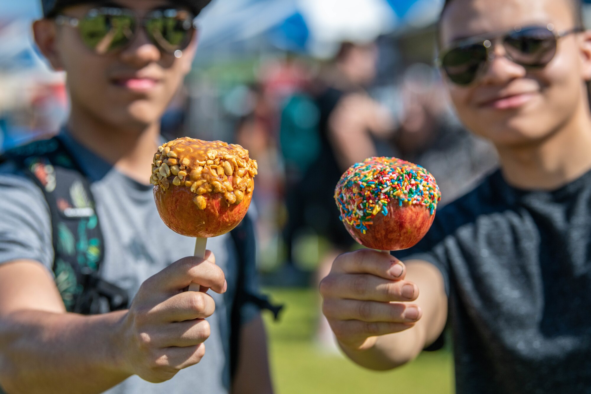 Attendees show off caramel apples