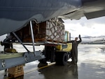Alaska Air National Guardsmen of the 211th Rescue Squadron and 176th Logistics Readiness Squadron load relief supplies on an HC-130J Combat King II at Joint Base Elmendorf-Richardson bound for Bethel Sept. 29, 2022. More than 130 members of the Alaska Organized Militia, which includes members of the Alaska National Guard, Alaska State Defense Force and Alaska Naval Militia, were activated Sept. 17 after remnants of Typhoon Merbok caused dramatic flooding across more than 1,000 miles of Alaskan coastline.