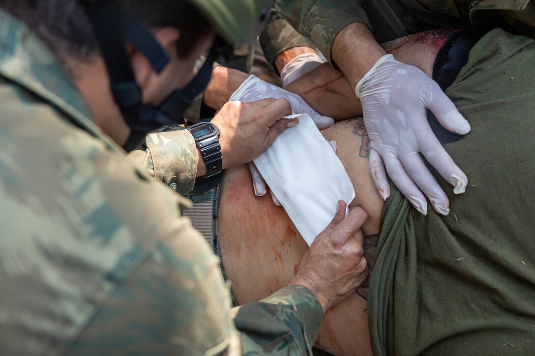 Brazilian marines perform a simulated casualty evacuation during a surgical training event during exercise UNITAS LXIII in Marambaia, Brazil, Sept. 10, 2022. The training event consisted of a medical equipment presentation, a field surgery, and a CASEVAC via a Brazilian armored personnel carrier. UNITAS is the world’s longest-running annual multinational maritime exercise that focuses on enhancing interoperability among multiple nations and joint forces during littoral and amphibious operations in order to build on existing regional partnerships and create new enduring relationships that promote peace, stability, and prosperity in the U.S. Southern Command’s area of responsibility. (U.S. Marine Corps photo by Lance Cpl. David Intriago)