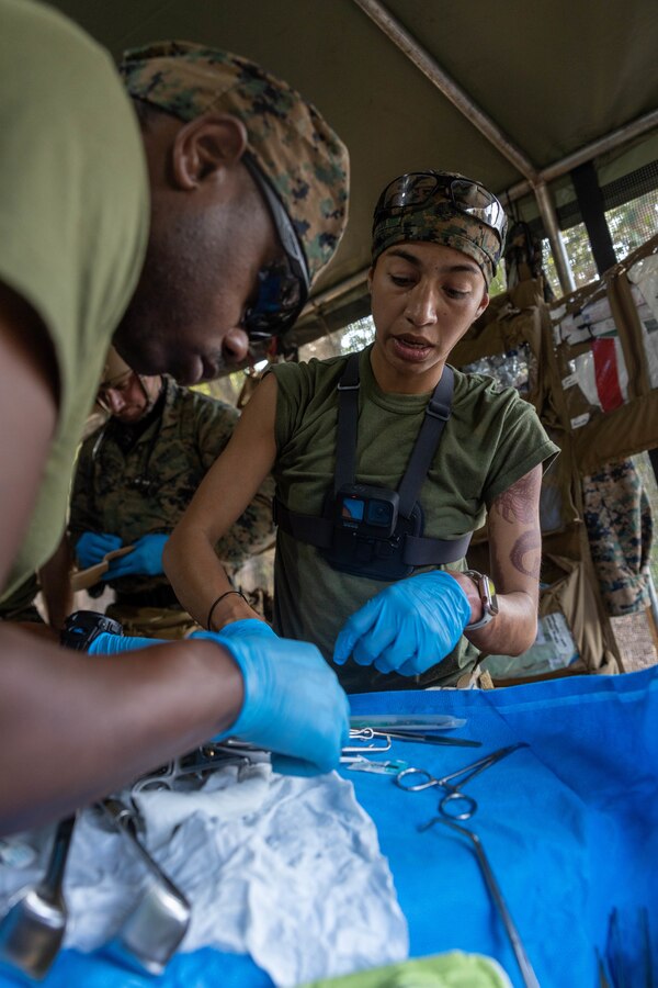 U.S. Navy Lt. Cmdr. Marissa Mayor, a general surgeon from 2nd Medical Battalion, 2nd Marine Logistics Group, in support of Special Purpose Marine Air-Ground Task Force UNITAS LXIII performs surgery at a surgical training event during exercise UNITAS LXIII in Marambaia, Brazil, Sept. 10, 2022. The training event consisted of a medical equipment presentation, a field surgery, and a CASEVAC via a Brazilian armored personnel carrier. UNITAS is the world’s longest-running annual multinational maritime exercise that focuses on enhancing interoperability among multiple nations and joint forces during littoral and amphibious operations in order to build on existing regional partnerships and create new enduring relationships that promote peace, stability, and prosperity in the U.S. Southern Command’s area of responsibility. (U.S. Marine Corps photo by Lance Cpl. David Intriago)