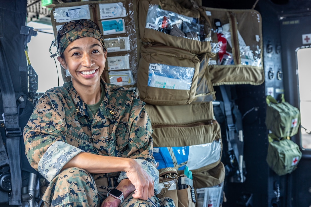 U.S. Navy Lt. Cmdr. Marissa Mayor, a general surgeon with 2nd Medical Battalion, 2nd Marine Logistics Group, in support of Special Purpose Marine Air-Ground Task Force UNITAS LXIII poses for a picture on a UH-1Y Venom helicopter with her surgical instruments while aboard the amphibious transport dock ship USS Mesa Verde (LPD 19) while supporting a surgical training event during exercise UNITAS LXIII in the Atlantic Ocean, Sept. 17, 2022. The training event consisted of Marines patrolling, taking simulated casualties, and simulated lifesaving surgery. UNITAS is the world’s longest-running annual multinational maritime exercise that brings together forces from 19 countries to include Brazil, Cameroon, Chile, Colombia, Dominican Republic, Ecuador, France, Guyana, Jamaica, Mexico, Namibia, Panama, Paraguay, Peru, South Korea, Spain, the United Kingdom, the United States, and Uruguay. The exercise focuses on enhancing interoperability among multiple nations and joint forces during littoral and amphibious operations in order to build on existing regional partnerships and create new enduring relationships that promote peace, stability, and prosperity in the U.S. Southern Command’s area of responsibility. (U.S. Marine Corps photo by Cpl. Ryan Schmid)