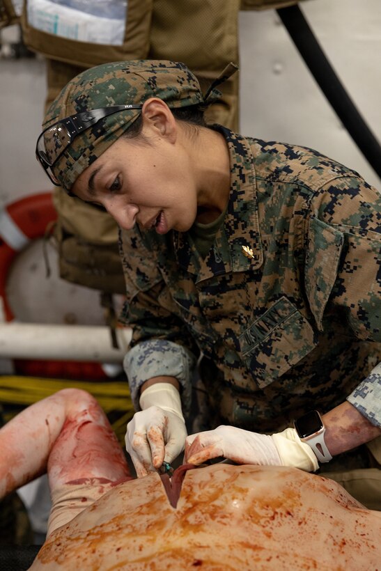 U.S. Navy Lt. Cmdr. Marissa Mayor, a general surgeon with 2nd Medical Battalion, 2nd Marine Logistics Group, in support of Special Purpose Marine Air-Ground Task Force UNITAS LXIII performs simulated surgery while participating in a surgical training event aboard the amphibious transport dock ship USS Mesa Verde (LPD 19) during exercise UNITAS LXIII in the Atlantic Ocean, Sept. 17, 2022. The training event consisted of Marines patrolling, taking simulated casualties, and simulated lifesaving surgery. UNITAS develops and sustains relationships that improve the capacity of our reemerging and enduring maritime partners to achieve common objectives. Additionally, the military-to-military exchanges foster friendly, mutual cooperation and understanding among participating navies and marine corps. (U.S. Marine Corps photo by Cpl. Ryan Schmid)