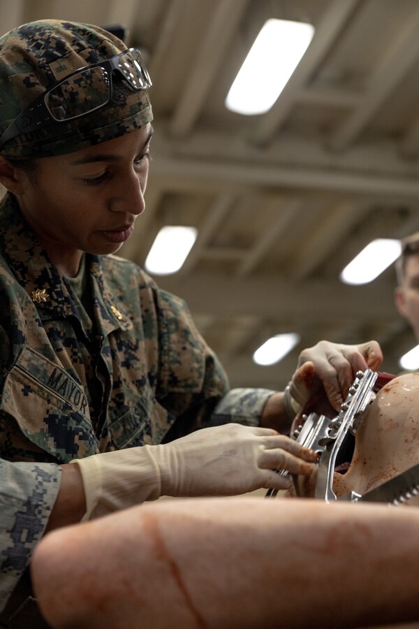 U.S. Navy Lt. Cmdr. Marissa Mayor, a general surgeon with 2nd Medical Battalion, 2nd Marine Logistics Group, in support of Special Purpose Marine Air-Ground Task Force UNITAS LXIII performs simulated surgery while participating in a surgical training event aboard the amphibious transport dock ship USS Mesa Verde (LPD 19) during exercise UNITAS LXIII in the Atlantic Ocean, Sept. 17, 2022. The training event consisted of Marines patrolling, taking simulated casualties, and simulated lifesaving surgery. UNITAS develops and sustains relationships that improve the capacity of our reemerging and enduring maritime partners to achieve common objectives. Additionally, the military-to-military exchanges foster friendly, mutual cooperation and understanding among participating navies and marine corps. (U.S. Marine Corps photo by Cpl. Ryan Schmid)