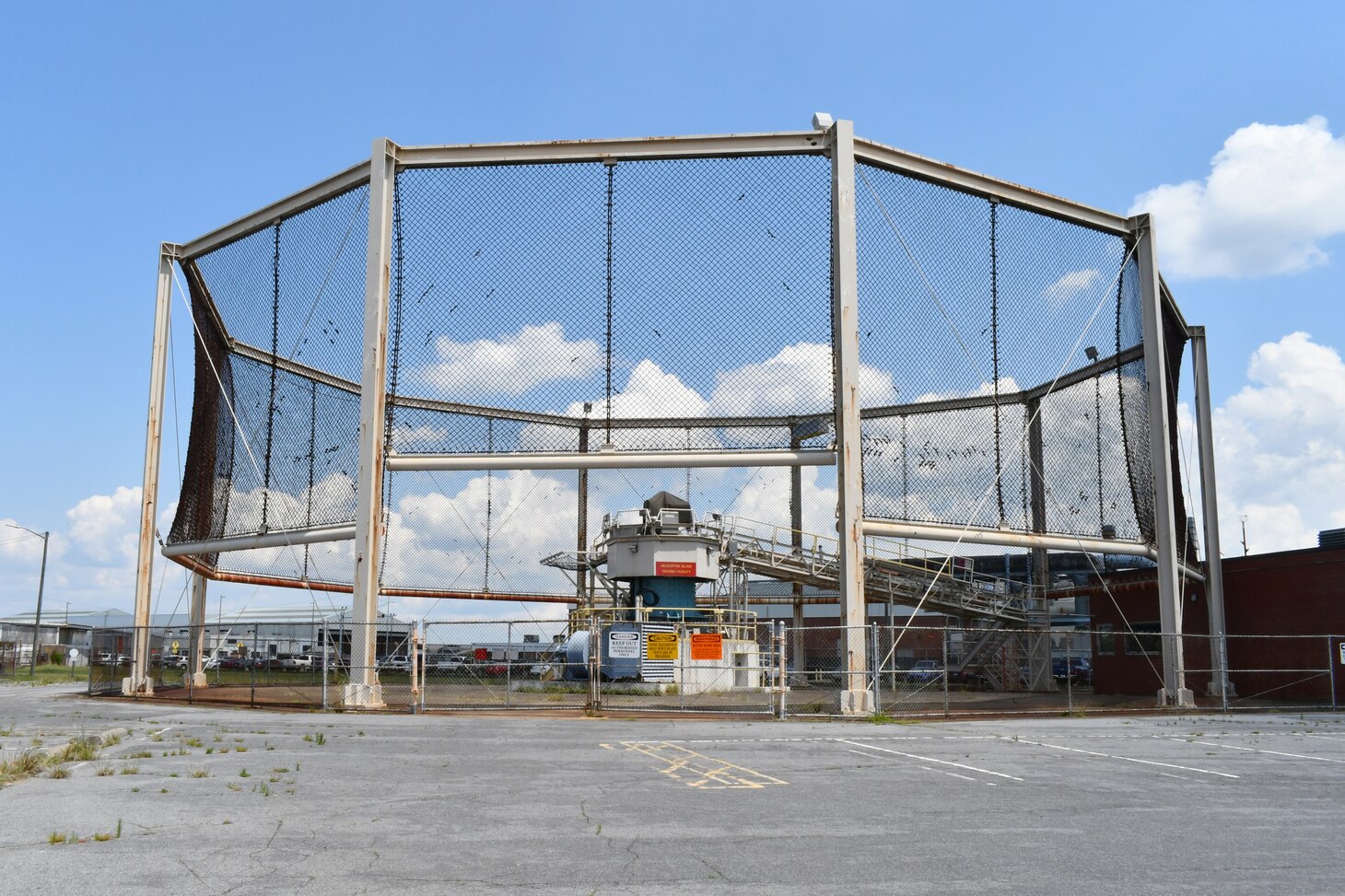 The Helicopter Blade Balance Facility’s whirl tower has traditionally been used to balance helicopter rotor blades at Fleet Readiness Center East. However, the H-53K program is opting to use the universal static balance fixture (USBF) instead of the whirl tower to balance its blades, because the USBF can accommodate the increased length and weight of the blades for the new helicopter.