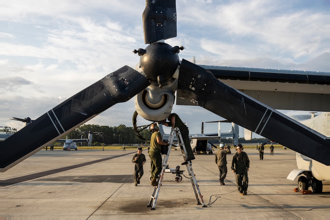 U.S. Marines with Marine Medium Tiltrotor Squadron (VMM) 162 maintain the engine of an MV-22B Osprey at Marine Corps Air Station New River, North Carolina, Sept. 19, 2022. VMM-162 prepared personnel and aircraft in support of a Weapons and Tactics Instructor Course at Marine Corps Air Station Yuma, Arizona. VMM-162 is a subordinate unit of 2nd Marine Aircraft Wing, the aviation combat element of II Marine Expeditionary Force. (U.S. Marine Corps photo by Cpl. Christopher Hernandez)