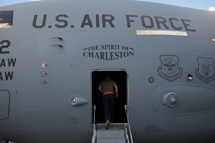 An Airman walks into a C-17 Globemaster III