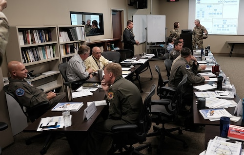 photo of US military personnel sitting at tables