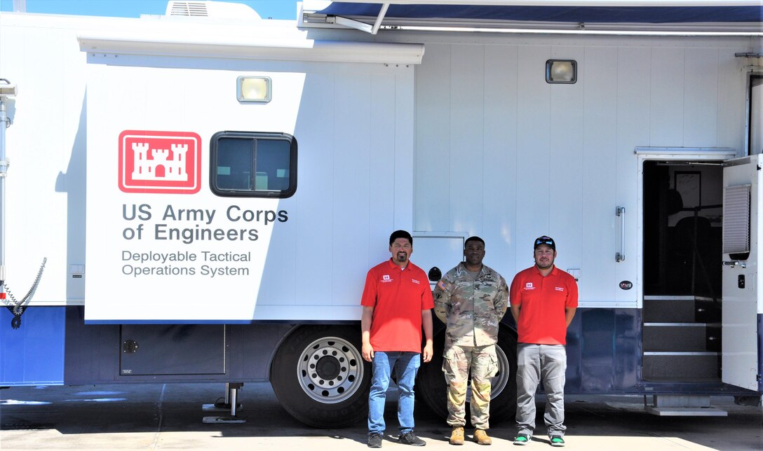 The Army Corps of Engineer's DTOS team pose with the Emergency Command and Control Vehicle, Sept. 25, 2022, at MAS Miramar near San Diego, Calif. From left are Baron Arakawa, Emergency Operations Branch; Capt. Donnell Smith, San Diego Resident Office; and Sergio Valdovinos, LA District Operations Branch.