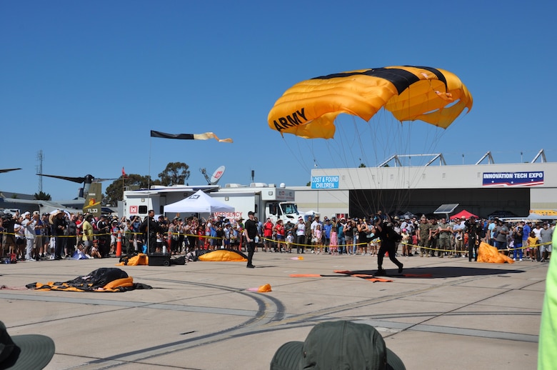 A Soldier of the Golden Knights parachute unit lands on the X at Marine Air Station Miramar, Sept. 25, near San Diego, Calif. The Army Corps of Engineers Los Angeles District DTOS at the landing zone is in the background.