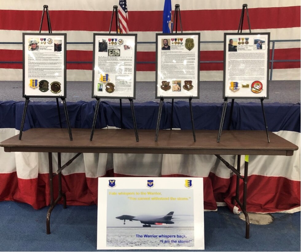 Photos are displayed during the Raider Heritage Rally at Ellsworth Air Force Base, S.D., October 8, 2021.