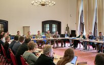 Members of the Noise Abatement Commission exchange ideas and opinions at the semi-annual Noise Abatement Commission meeting at Katterbach Army Airfield, Sept. 27, 2022. Noise Abatement Commission meetings are scheduled twice a year in the spring and fall to discuss the 12 CAB Summer Flight Program. 12 CAB is among other units assigned to V Corps, America's Forward Deployed Corps in Europe. They work alongside NATO Allies and regional security partners to provide combat-ready forces, execute joint and multinational training exercises, and retain command and control for all rotational and assigned units in the European Theater. (U.S. Army photo by Staff Sgt. Thomas Mort)