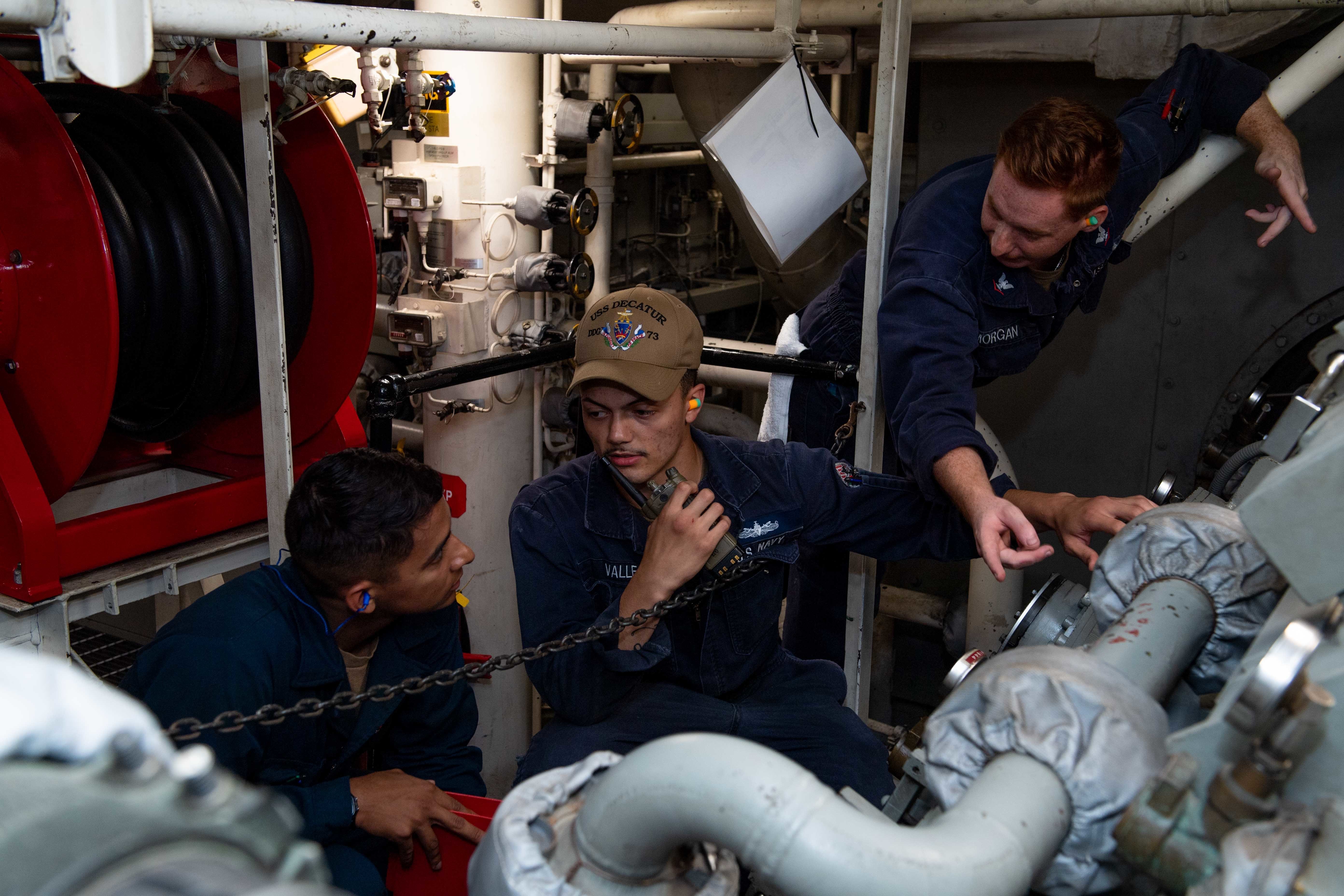 Sailors check the bearing temperature on the main reduction gear aboard USS Decatur (DDG 73).