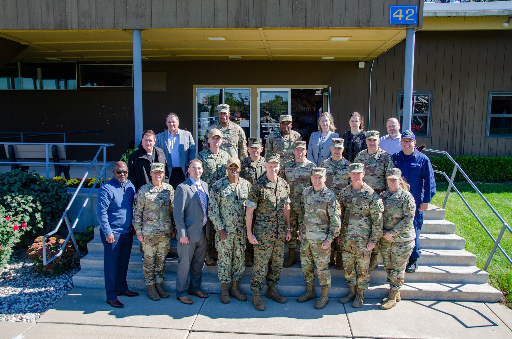 Joint Recruiting Commander’s Conference (JRCC) attendees take a group photo in front of The National Museum of the American Sailor in North Chicago, Ill. The conference brought together Recruiting Command, Accession Policy and USMEPCOM leaders to discuss issues and opportunities for collaboration and share ideas and best practices.