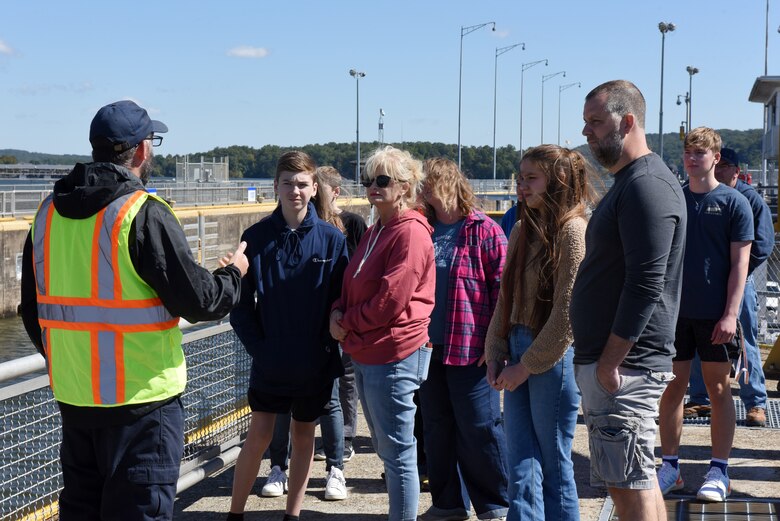 Lock Operator Josh Shockey (wearing reflective vest) leads a group of homeschoolers from Christian Academy of Knoxville on a tour Sept. 29, 2022, of Fort Loudoun Lock on the Tennessee River in Lenoir City, Tennessee. (USACE Photo by Lee Roberts)
