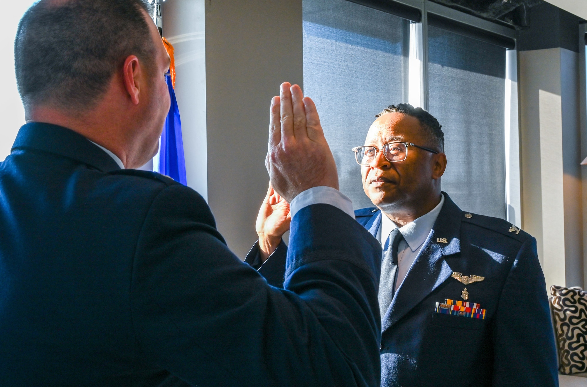 Col. Michael Parks, 507th Air Refueling Wing commander, administers the oath of office to Col. Alvin Bradford, 507th Medical Squadron commander, during a promotion ceremony September 30, 2022, Oklahoma City, Oklahoma. (U.S. Air Force photo by 2nd Lt. Mary Begy)