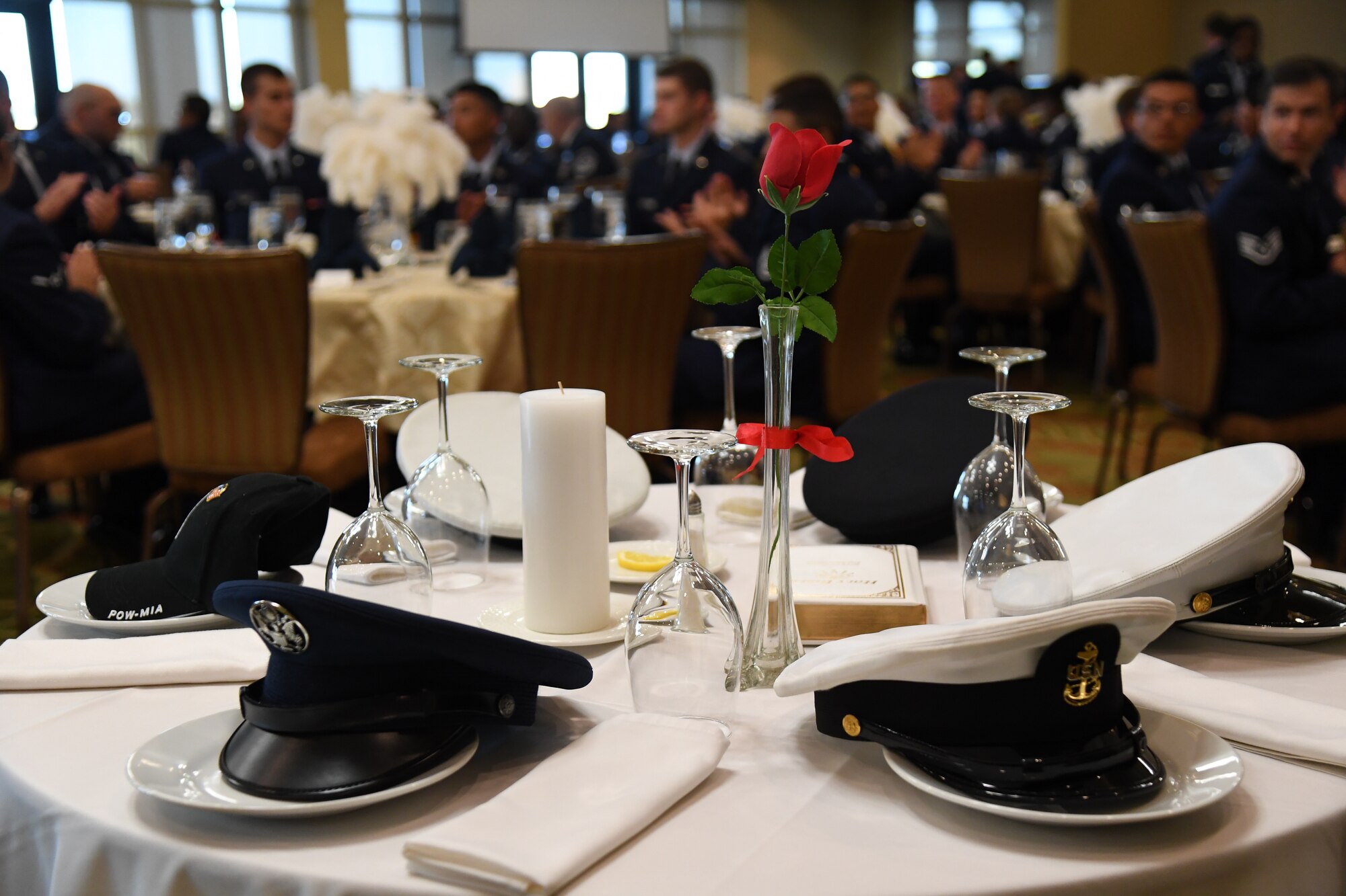 A POW/MIA table is on display during the 81st Training Group Airman's Ball inside the Bay Breeze Event Center at Keesler Air Force Base, Mississippi, Sept. 30, 2022. The event was geared toward Airmen in training on how to participate and act during a formal military ball so they can feel confident in their abilities when arriving at their follow-on locations. The Airmen served in key positions throughout the ball such as emcees, color guard, POW/MIA table ceremony, national anthem singer and the invocation. (U.S. Air Force photo by Kemberly Groue)