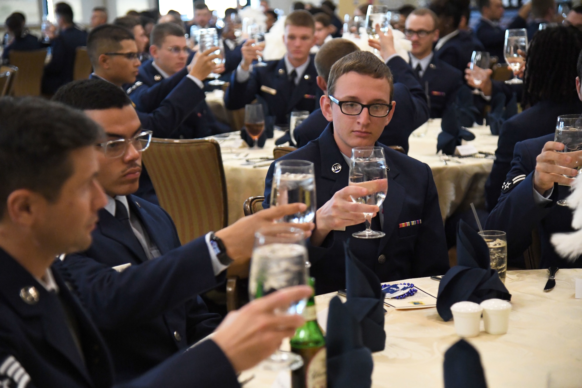 U.S. Air Force Col. Laura King, 81st Training Group commander, delivers remarks during the 81st Training Group Airman's Ball inside the Bay Breeze Event Center at Keesler Air Force Base, Mississippi, Sept. 30, 2022. The event was geared toward Airmen in training on how to participate and act during a formal military ball so they can feel confident in their abilities when arriving at their follow-on locations. The Airmen served in key positions throughout the ball such as emcees, color guard, POW/MIA table ceremony, national anthem singer and the invocation. (U.S. Air Force photo by Kemberly Groue)