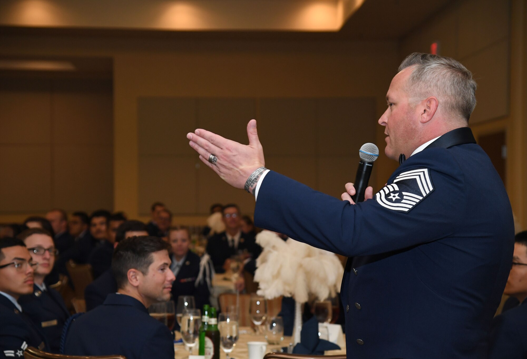 U.S. Air Force Chief Master Sgt. Jeremy Phillips, 81st Training Group senior enlisted leader, delivers remarks during the 81st Training Group Airman's Ball inside the Bay Breeze Event Center at Keesler Air Force Base, Mississippi, Sept. 30, 2022. The event was geared toward Airmen in training on how to participate and act during a formal military ball so they can feel confident in their abilities when arriving at their follow-on locations. The Airmen served in key positions throughout the ball such as emcees, color guard, POW/MIA table ceremony, national anthem singer and the invocation. (U.S. Air Force photo by Kemberly Groue)