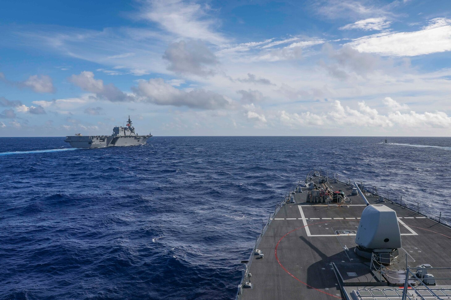 Arleigh Burke-class guided-missile destroyer USS Higgins (DDG 76), center, cruises in formation with Izumo-class multi-purpose destroyer JS Izumo (DDH 183) left, and  a Japanese submarine while conducting routine operations in the South China Sea, Oct. 1. Higgins is participating in multi-lateral exercises in the South China Sea in support of the Japan Maritime Self-Defense Force’s Indo-Pacific deployment, along with the Royal Canadian Navy. Routine multi-lateral exercises like this strengthen interoperability and our mutual commitment to maintaining a free and open Indo-Pacific.  (U.S. Navy photo by Mass Communication Specialist 1st Class Donavan K. Patubo)