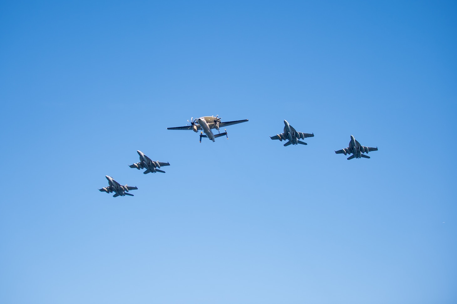 WATERS EAST OF THE KOREAN PENINSULA (Sept. 29, 2022) Aircraft assigned to Carrier Air Wing (CVW) 5 fly over a formation of U.S. Navy and Republic of Korea (ROK) Navy ships in waters east of the Korean Peninsula, Sept. 29. The Ronald Reagan Carrier Strike Group (CSG) is participating with the ROK Navy in Maritime Counter Special Operations Exercise (MCSOFEX) to strengthen interoperability and training. The U.S. routinely conducts CSG operations in the waters around the ROK to exercise maritime maneuvers, strengthen the U.S.-ROK alliance, and improve regional security. (U.S. Navy photo by Mass Communication Specialist Seaman Natasha ChevalierLosada)