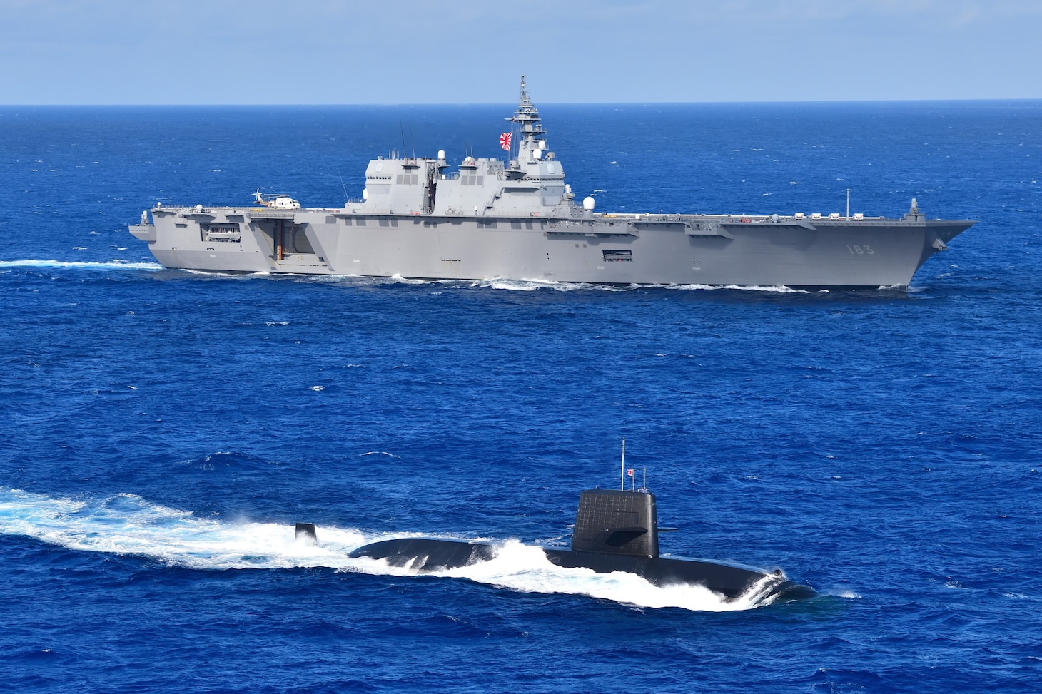 Arleigh Burke-class guided-missile destroyer USS Higgins (DDG 76), cruises in formation with Izumo-class multi-purpose destroyer JS Izumo (DDH 183) and a Japanese submarine while conducting routine operations in the South China Sea, Oct. 1. Higgins is participating in multi-lateral exercises in the South China Sea in support of the Japan Maritime Self-Defense Force’s Indo-Pacific deployment, along with the Royal Canadian Navy. Routine multi-lateral exercises like this strengthen interoperability and our mutual commitment to maintaining a free and open Indo-Pacific.