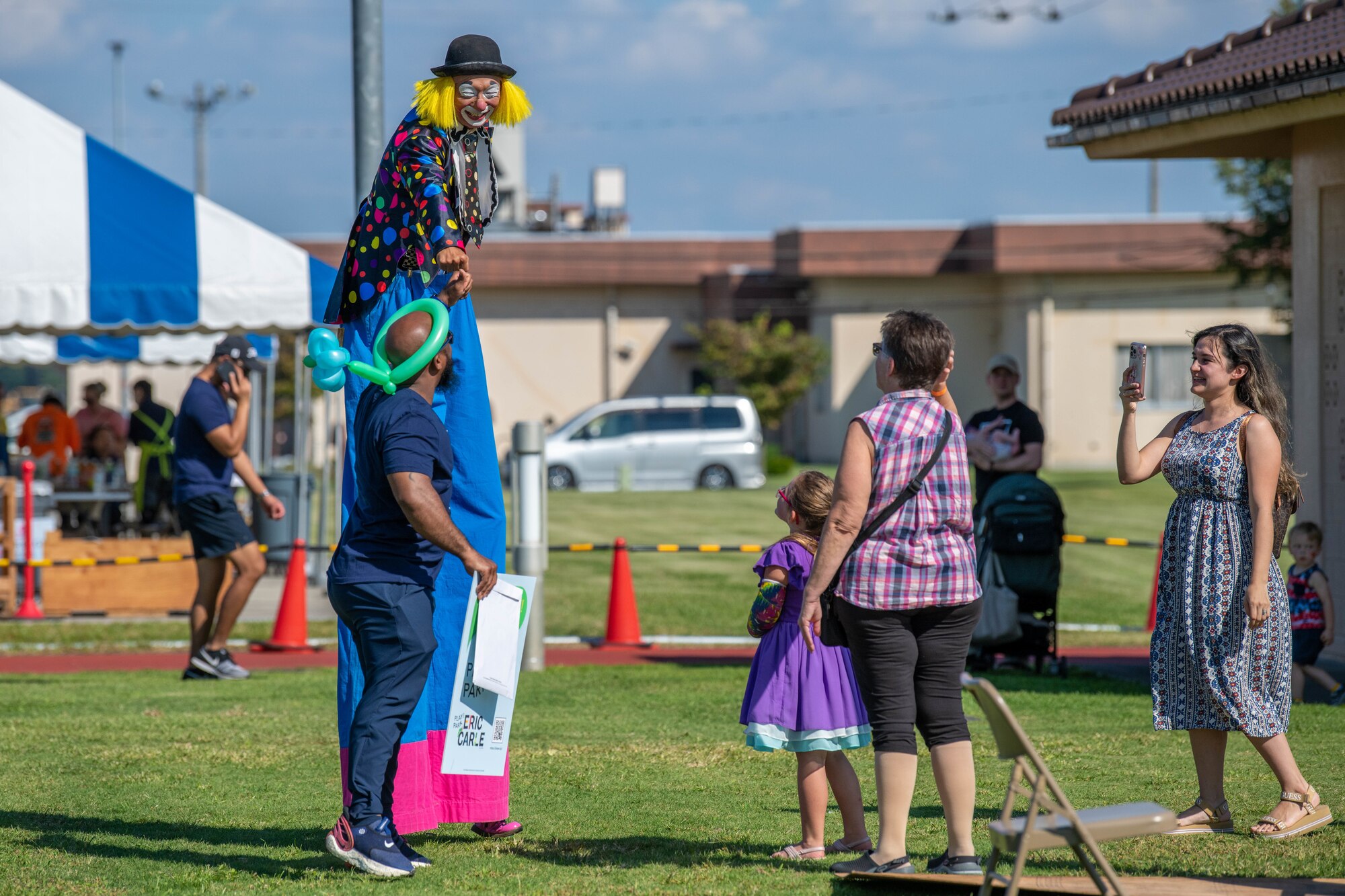 A local performer and an attendee fist-bump