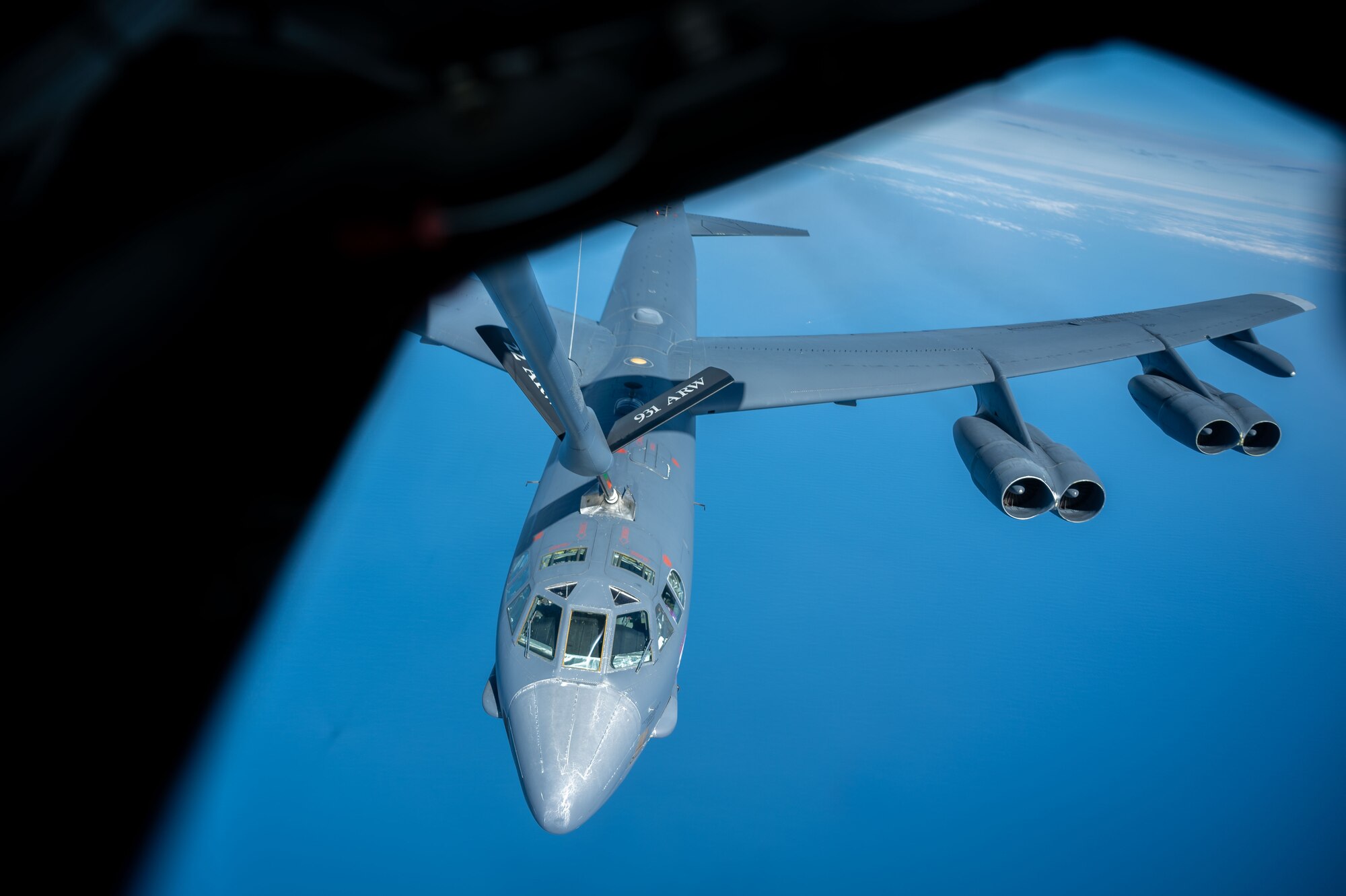 Plane refuels in the sky.