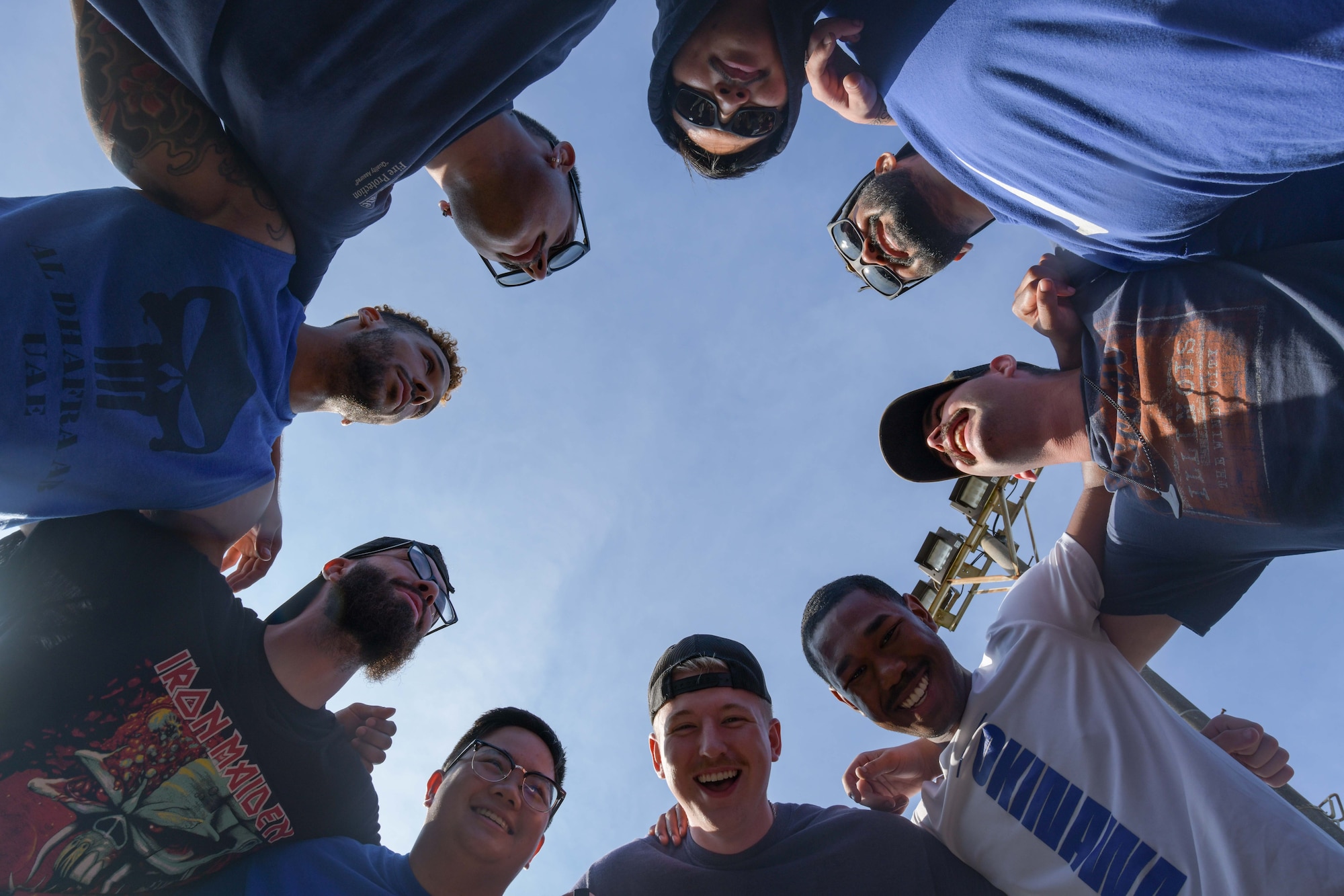 Airmen form a huddle before a game.