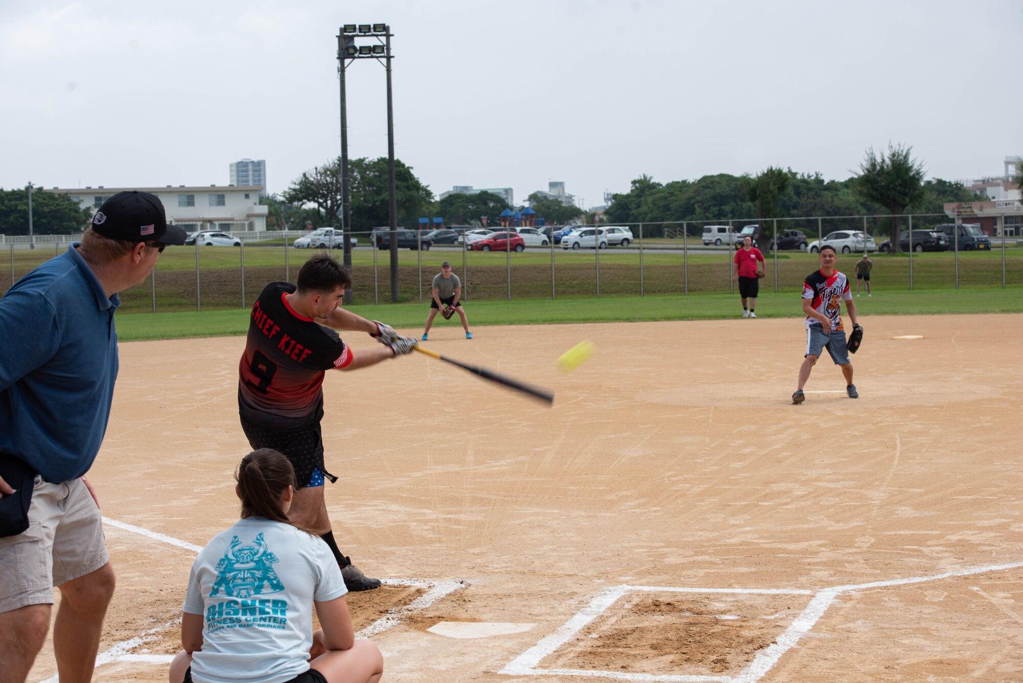 Airmen play a game of softball.