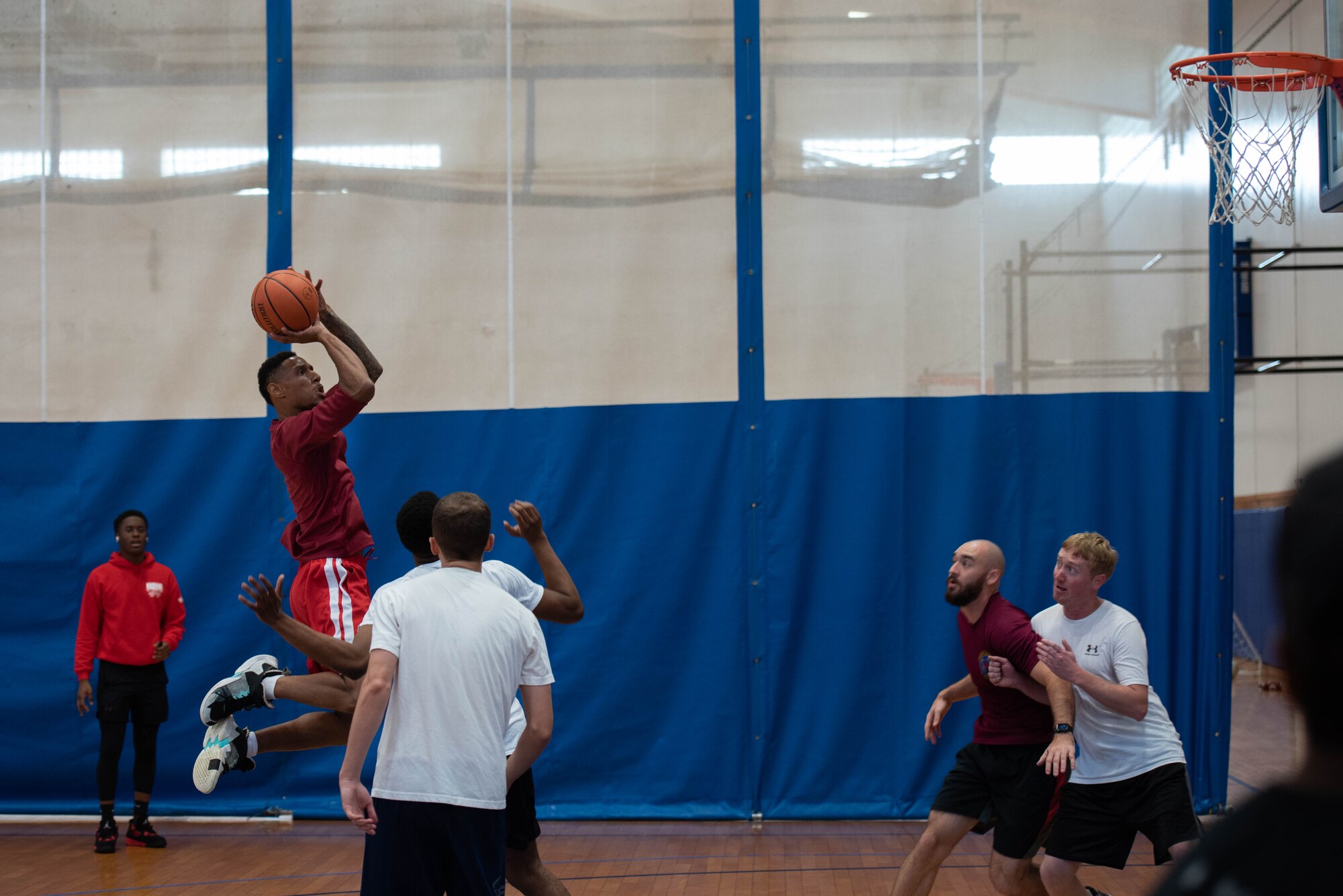 Airmen play a game of basketball.