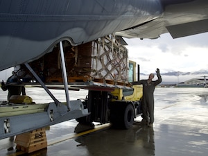 Alaska Air National Guardsmen of the 211th Rescue Squadron and 176th Logistics Readiness Squadron load relief supplies on an HC-130J Combat King II at Joint Base Elmendorf-Richardson bound for Bethel Sept. 29, 2022. More than 130 members of the Alaska Organized Militia, which includes members of the Alaska National Guard, Alaska State Defense Force and Alaska Naval Militia, were activated Sept. 17 after remnants of Typhoon Merbok caused dramatic flooding across more than 1,000 miles of Alaskan coastline.