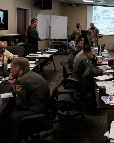 photo of US military personnel sitting at tables