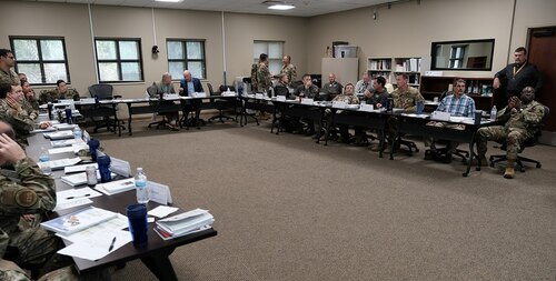 photo of US military personnel sitting at tables