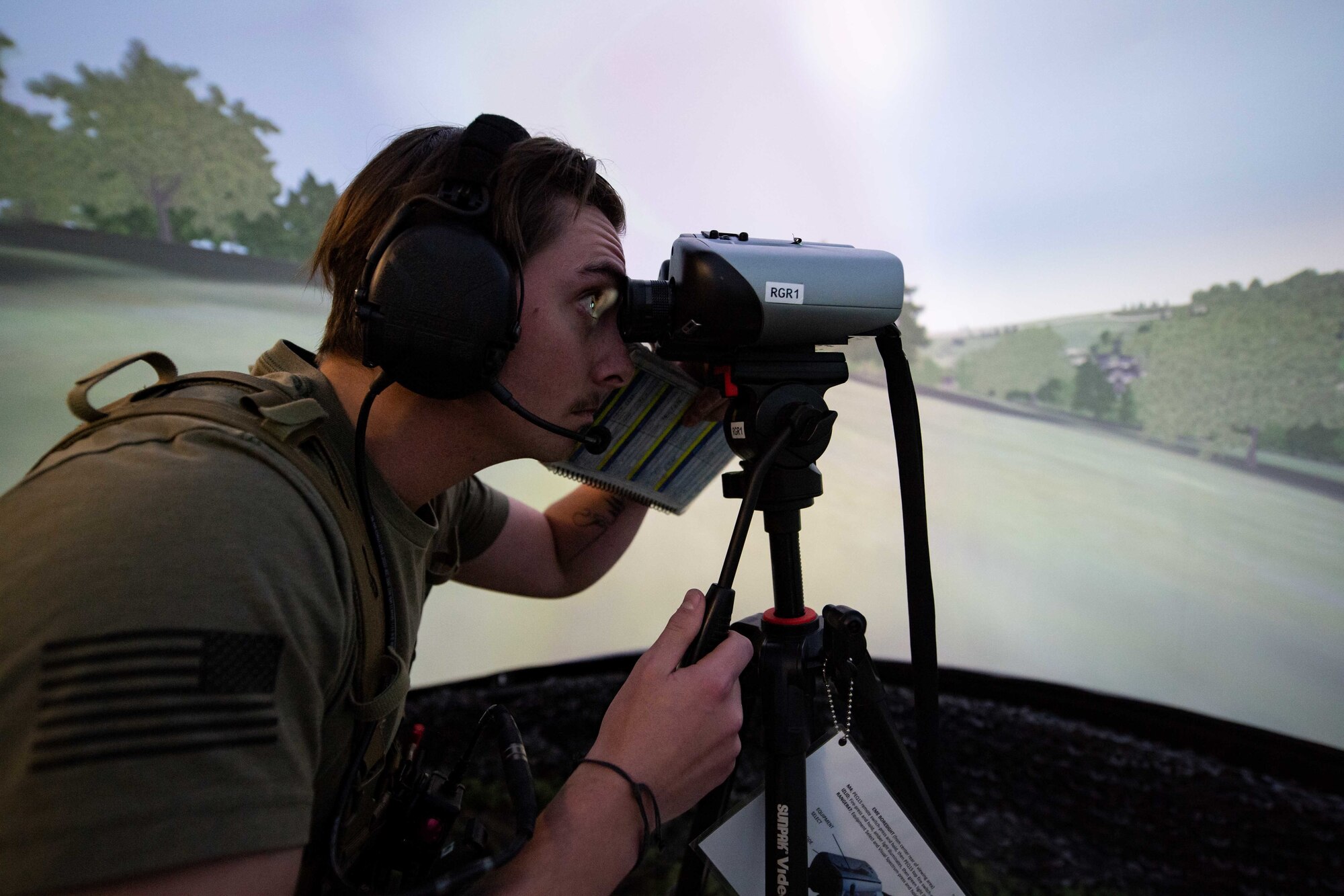 A U.S. Air Force Airman, assigned to the 4th Air Support Operations Group as a tactical air control party Airman, engages in a training scenario utilizing the U.S. Air Forces in Europe – Air Forces Africa Warfare Center’s joint terminal attack controller domed simulator