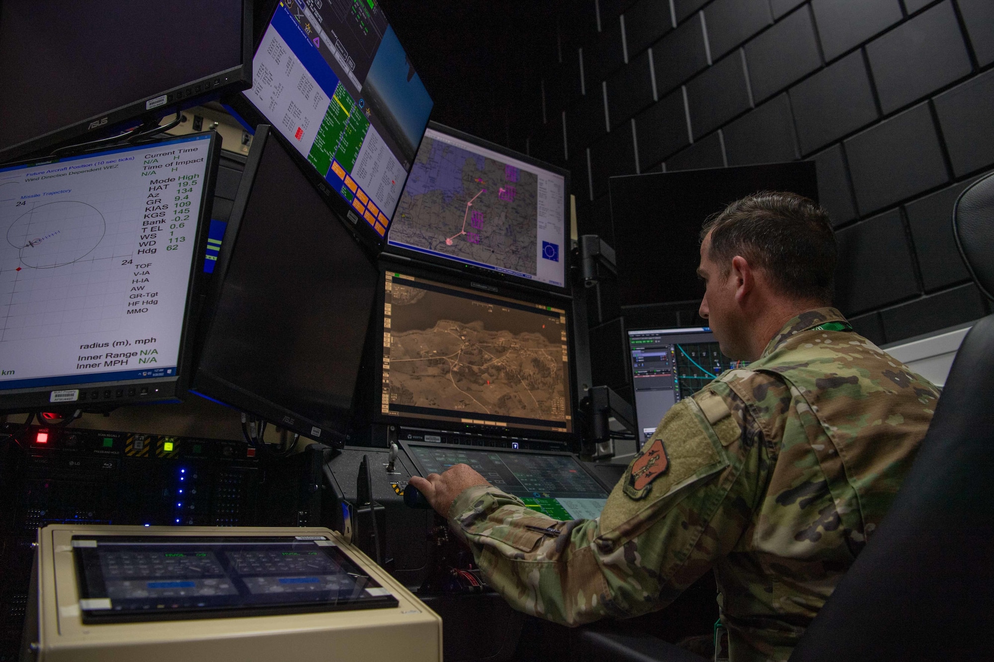 .S. Air Force Tech. Sgt. Matthew Choiniere, 178th Operations Support Squadron noncommissioned officer in charge of intel training, operates an aircraft sensor simulator during exercise Spartan Warrior 22-9